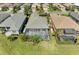 Beautiful aerial view of a home with screened-in pool and lush landscaping at 5023 Tobermory Way, Bradenton, FL 34211