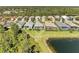 Aerial view of home, water view, and lush landscaping at 5023 Tobermory Way, Bradenton, FL 34211