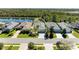 Aerial view of home with lush backyard and nearby lake at 5023 Tobermory Way, Bradenton, FL 34211