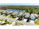 Aerial view of home with lush backyard and nearby lake at 5023 Tobermory Way, Bradenton, FL 34211