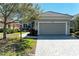 Charming single-story home with a two-car garage and beautifully landscaped front yard at 5023 Tobermory Way, Bradenton, FL 34211