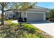Charming home with a two-car garage, paver driveway, and well-maintained landscaping at 5023 Tobermory Way, Bradenton, FL 34211