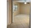 Spacious bedroom featuring neutral walls, ceiling fan and tile floors at 7030 W Country Club N Dr # 128, Sarasota, FL 34243
