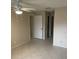 Bright bedroom featuring tile flooring, neutral walls and ceiling fan at 7030 W Country Club N Dr # 128, Sarasota, FL 34243