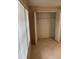 Open closet with plenty of storage space and bi-fold doors at 7030 W Country Club N Dr # 128, Sarasota, FL 34243