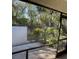 Enclosed patio with landscaping views at 7030 W Country Club N Dr # 128, Sarasota, FL 34243