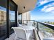 Balcony with seating offers breathtaking views of the ocean and community landscape, perfect for relaxing at 1211 Gulf Of Mexico Dr # 301, Longboat Key, FL 34228
