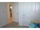Comfortable bedroom featuring closet and doorway that leads to dining area at 12525 Lily Quartz Loop, Parrish, FL 34219