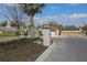 Inviting community entrance showcasing a gate, manicured landscaping, and signage for a secure and appealing welcome at 12525 Lily Quartz Loop, Parrish, FL 34219