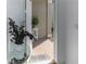 Bright foyer featuring a welcome mat, brick floor, and a view through to a beautiful, sunny courtyard at 12525 Lily Quartz Loop, Parrish, FL 34219