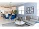 Open concept living area with a living room and eat-in kitchen with modern decor and comfortable furniture at 12525 Lily Quartz Loop, Parrish, FL 34219