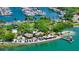 Amazing aerial view of waterfront restaurant with beach, clear water, and many palm trees at 2264 Floyd St, Sarasota, FL 34239