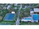 Aerial shot of community tennis courts and swimming pool in a residential neighborhood at 2264 Floyd St, Sarasota, FL 34239