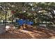A modern playground with colorful climbing structures and a cushioned ground surface offers a safe play area at 2264 Floyd St, Sarasota, FL 34239