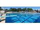 A large outdoor pool with lane markers and a diving board provides recreation and exercise at 2264 Floyd St, Sarasota, FL 34239