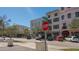 Picturesque street view with attractive buildings, a stop sign, and trees lining the sidewalk at 2264 Floyd St, Sarasota, FL 34239