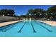 Swimming pool with lane markers, blue and white pennants, and neatly organized deck chairs at 2264 Floyd St, Sarasota, FL 34239