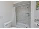 Bathroom featuring updated tiling in the shower with neutral fixtures and decor at 4531 13Th E St, Ellenton, FL 34222