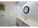Bright bathroom featuring a new vanity, sink, and mirror, complemented by white tiling at 4531 13Th E St, Ellenton, FL 34222