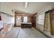 Unfinished bonus room space with workbench, natural light, and exterior access at 4531 13Th E St, Ellenton, FL 34222