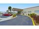 Exterior view of the clubhouse with a covered entrance and well-maintained landscaping at 4531 13Th E St, Ellenton, FL 34222