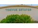 Tidevue Estates community signage amidst lush green landscaping at 4531 13Th E St, Ellenton, FL 34222