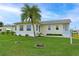 Charming single-story home with well-maintained lawn and a beautiful palm tree in the front yard at 4531 13Th E St, Ellenton, FL 34222