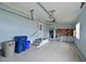 Spacious garage featuring ample storage, work area, and a convenient access door at 4531 13Th E St, Ellenton, FL 34222