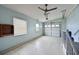 Clean garage space with overhead door, utility connections, and natural lighting at 4531 13Th E St, Ellenton, FL 34222