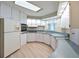 Bright kitchen featuring white cabinets, modern appliances, and a functional layout at 4531 13Th E St, Ellenton, FL 34222