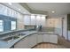 Kitchen with ample counter space, white cabinets, and convenient access to the dining area at 4531 13Th E St, Ellenton, FL 34222