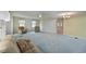 Comfortable living room featuring a ceiling fan, and views into the dining area at 4531 13Th E St, Ellenton, FL 34222