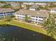 Aerial view of a community overlooking a pond at 4802 51St W St # 521, Bradenton, FL 34210