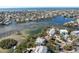 Gorgeous aerial shot displays upscale homes nestled along the picturesque waterfront community at 517 Blue Heron Dr, Anna Maria, FL 34216