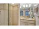 Bathroom featuring walk-in shower with glass door and vanity with granite countertop at 5311 Gulf Of Mexico Dr # 3, Longboat Key, FL 34228