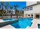 Beautiful pool and spa area with lush landscaping and an outdoor living space, perfect for relaxation and enjoyment at 6605 Gulf Dr, Holmes Beach, FL 34217