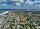 Expansive aerial view showcasing the neighborhood featuring condo buildings near local beach and waterways at 800 S Blvd Of Presidents # 12, Sarasota, FL 34236