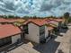 Exterior shot of condo buildings featuring well-maintained landscaping and a parking lot at 800 S Blvd Of Presidents # 12, Sarasota, FL 34236
