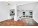 Bright living room featuring high ceilings, a stylish bar area, and neutral decor at 800 S Blvd Of Presidents # 12, Sarasota, FL 34236
