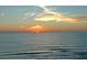 A serene ocean view at sunset, with the sun setting into the horizon at 800 S Blvd Of Presidents # 12, Sarasota, FL 34236