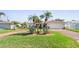 Inviting single-Gathering home featuring well-manicured lawn and tropical landscaping that adds beauty and curb appeal at 829 Harbor S Dr, Venice, FL 34285