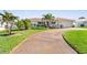 Attractive single-Gathering home featuring a well-manicured lawn and tropical landscaping, enhancing the curb appeal at 829 Harbor S Dr, Venice, FL 34285