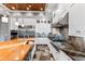 This kitchen features stainless steel appliances, light wood ceiling and black countertops at 8388 Catamaran Cir, Lakewood Ranch, FL 34202