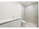 Modern bathroom features a walk-in shower and sleek vanity at 111 Golden Gate Pt # 701Ph, Sarasota, FL 34236