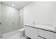Modern bathroom with a glass-enclosed shower and a sleek white vanity at 111 Golden Gate Pt # 701Ph, Sarasota, FL 34236