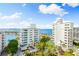 Beautiful building with tropical landscaping, near the beach and water at 111 Golden Gate Pt # 701Ph, Sarasota, FL 34236