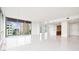 Bright, modern living space with large windows, and an open-concept kitchen at 111 Golden Gate Pt # 701Ph, Sarasota, FL 34236