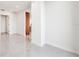 Bright living room featuring sleek tile flooring and a modern design at 111 Golden Gate Pt # 701Ph, Sarasota, FL 34236