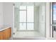 Spacious walk-in shower with dual shower heads and elegant tile work at 111 Golden Gate Pt # 701Ph, Sarasota, FL 34236