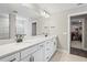 Bathroom boasts a double vanity with a quartz countertop and a separate shower at 12409 Wigeon Dr, Bradenton, FL 34212